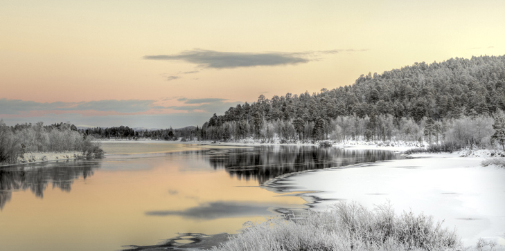 Decorative picture of a beautiful lake at sunset in winter.
