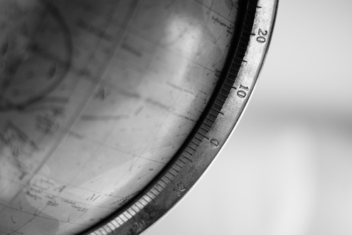 A decorative picture featuring a detail of a globe.