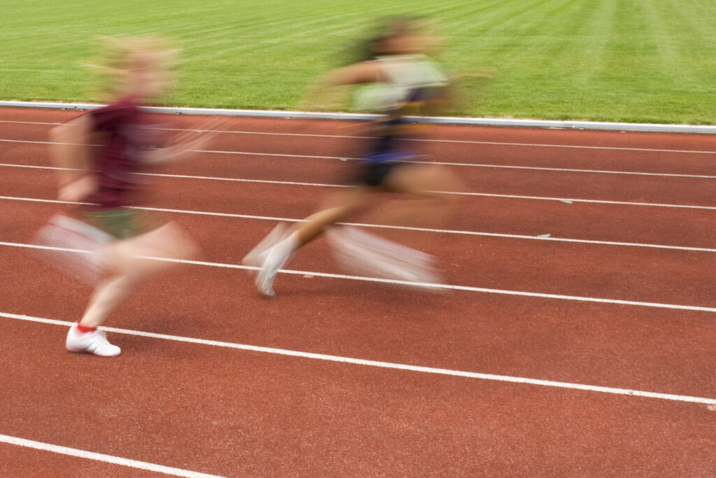 A decorative picture of two runners on the running track.