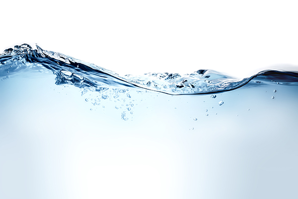 A decorative picture of a blue water wave and bubbles to clean drinking water