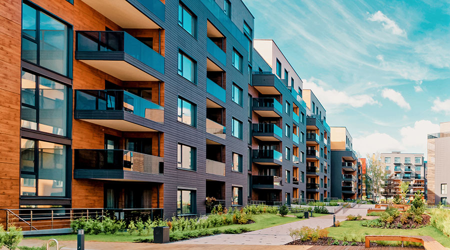 Kuvituskuva, jossa näkyy modernien kerrostalojen julkisivuja.